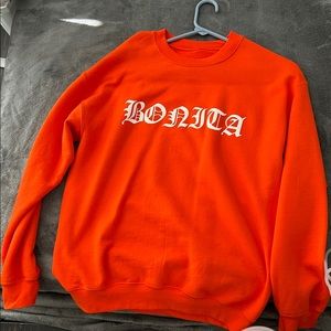 Orange crewneck sweater